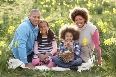 Happy family on Easter egg hunt in Smoky Mountain field