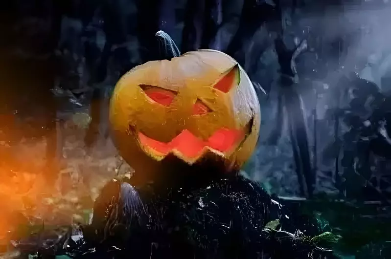 A creepy Halloween jack-o-lantern in the woods.