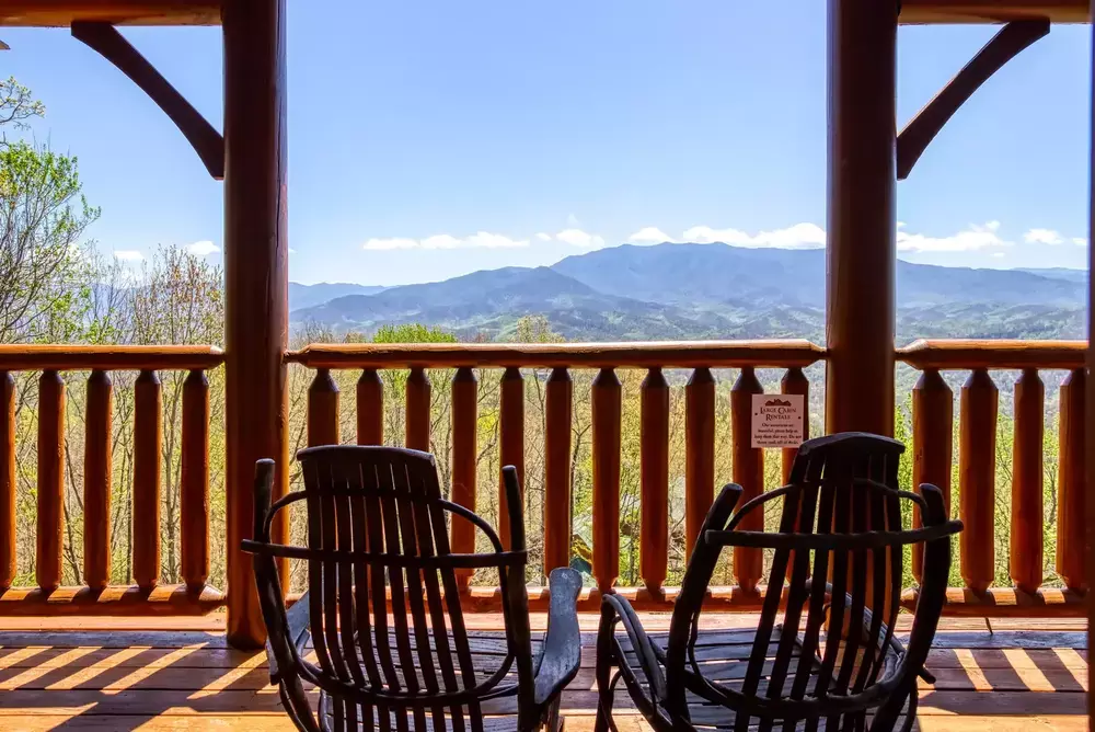 rocking chair on deck with  mountain view at Mount Leconte View Lodge